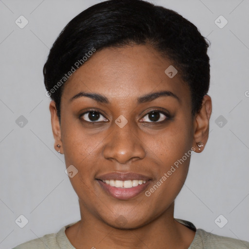 Joyful black young-adult female with short  black hair and brown eyes