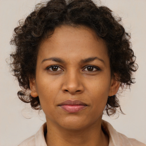 Neutral black young-adult female with medium  brown hair and brown eyes