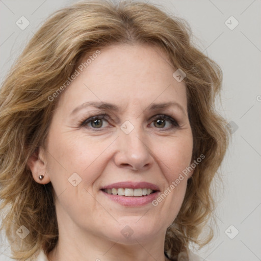 Joyful white adult female with medium  brown hair and grey eyes