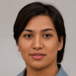 Joyful asian young-adult female with medium  brown hair and brown eyes