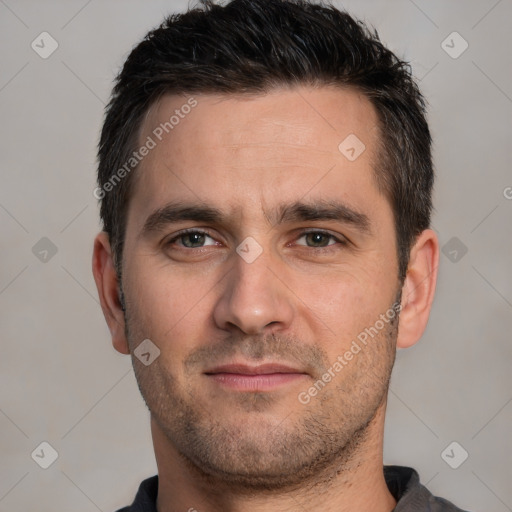 Joyful white young-adult male with short  black hair and brown eyes