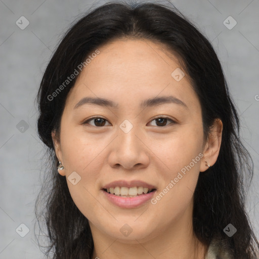 Joyful asian young-adult female with long  brown hair and brown eyes