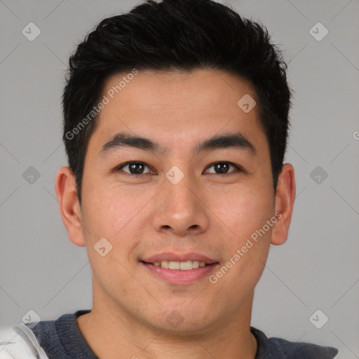 Joyful asian young-adult male with short  brown hair and brown eyes