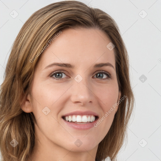 Joyful white young-adult female with long  brown hair and green eyes