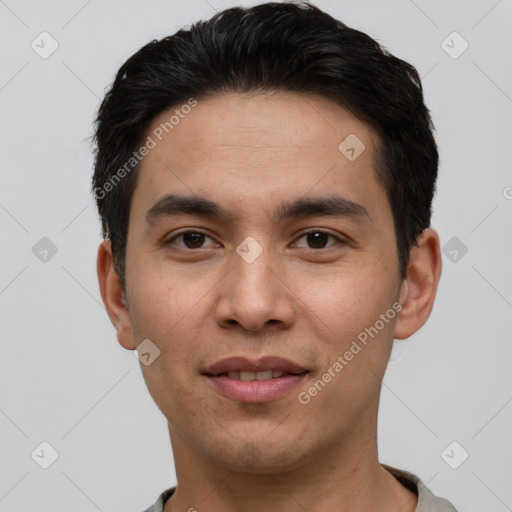 Joyful white young-adult male with short  black hair and brown eyes