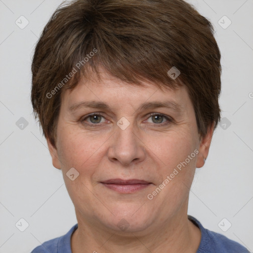 Joyful white adult female with short  brown hair and grey eyes