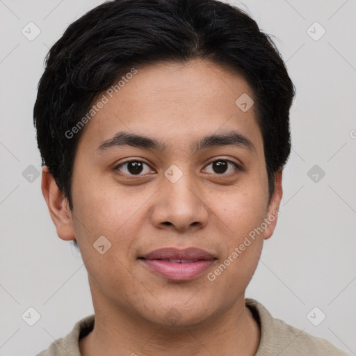 Joyful asian young-adult male with short  brown hair and brown eyes