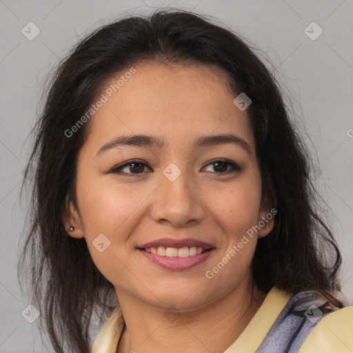 Joyful latino young-adult female with medium  brown hair and brown eyes