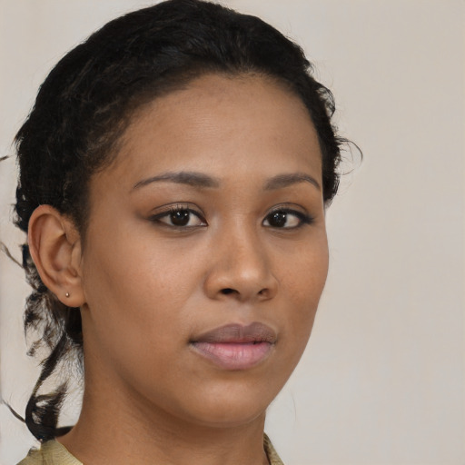 Neutral black young-adult female with medium  brown hair and brown eyes
