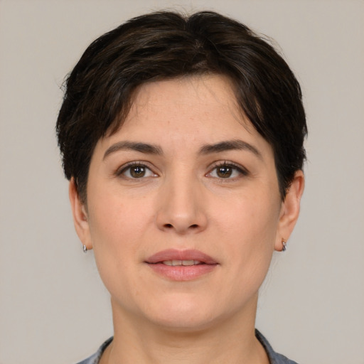 Joyful white young-adult female with short  brown hair and brown eyes