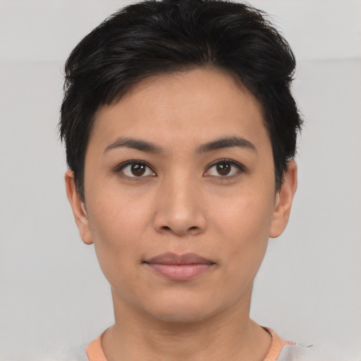 Joyful asian young-adult female with short  black hair and brown eyes