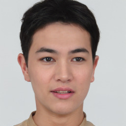 Joyful asian young-adult male with short  brown hair and brown eyes