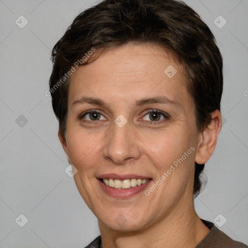 Joyful white adult female with short  brown hair and brown eyes