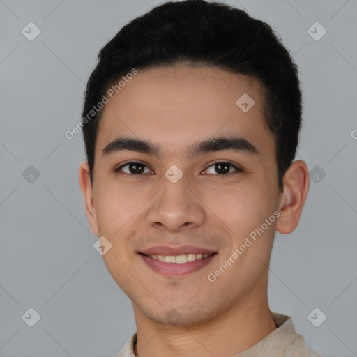 Joyful latino young-adult male with short  brown hair and brown eyes