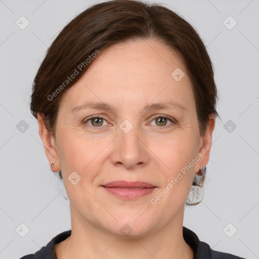 Joyful white adult female with short  brown hair and grey eyes