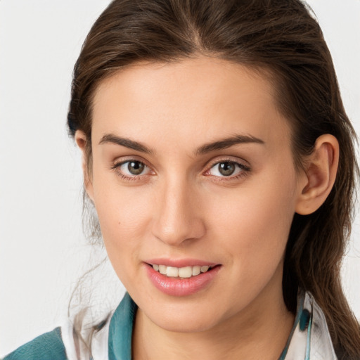 Joyful white young-adult female with medium  brown hair and blue eyes