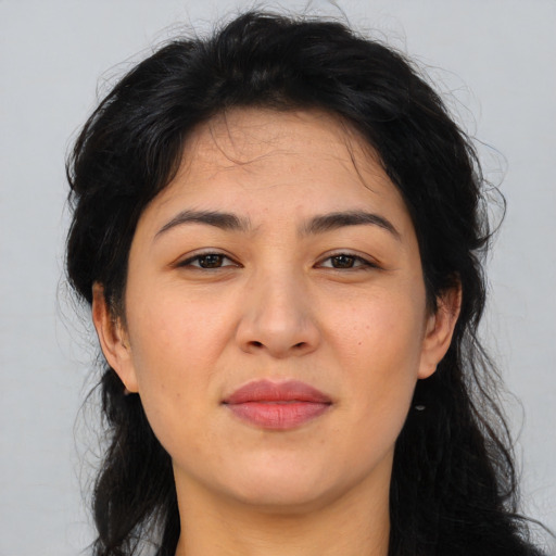 Joyful asian adult female with long  brown hair and brown eyes