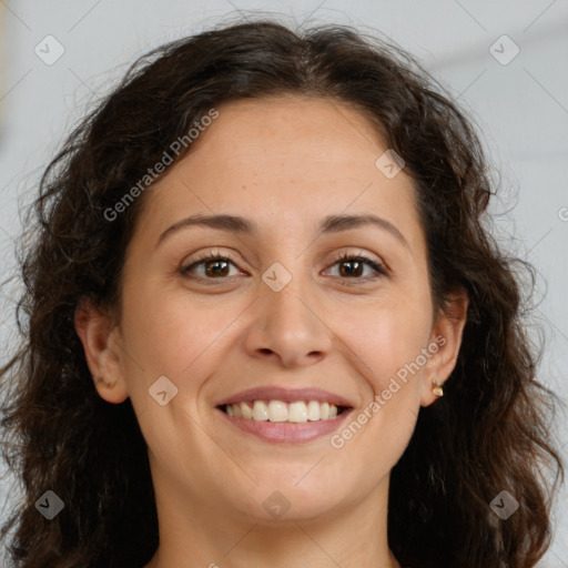 Joyful white adult female with long  brown hair and brown eyes