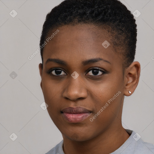 Joyful black young-adult female with short  black hair and brown eyes