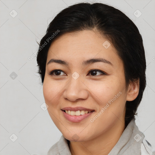 Joyful asian young-adult female with medium  brown hair and brown eyes