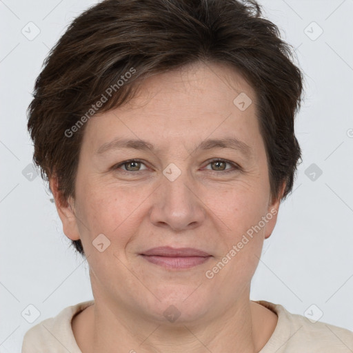 Joyful white adult female with short  brown hair and grey eyes