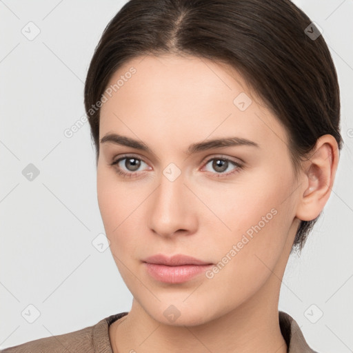 Neutral white young-adult female with short  brown hair and brown eyes