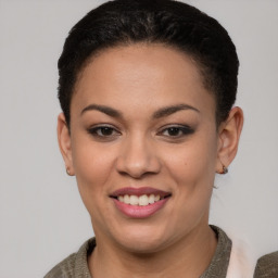 Joyful latino young-adult female with short  brown hair and brown eyes