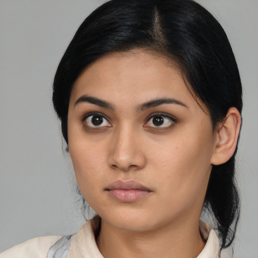 Neutral latino young-adult female with medium  black hair and brown eyes