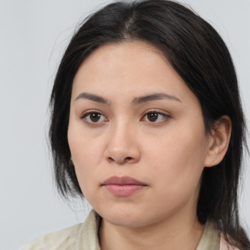 Neutral asian young-adult female with medium  brown hair and brown eyes