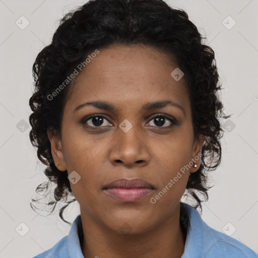Joyful black young-adult female with long  black hair and brown eyes