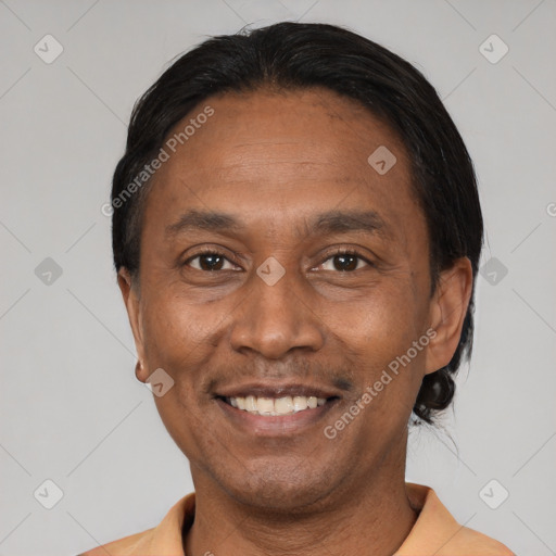 Joyful latino adult male with short  black hair and brown eyes
