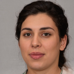 Joyful white young-adult female with medium  brown hair and brown eyes