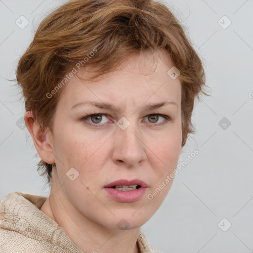 Joyful white adult female with medium  brown hair and blue eyes