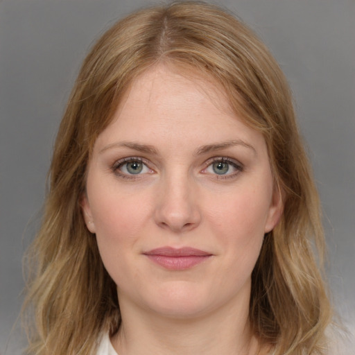 Joyful white young-adult female with medium  brown hair and blue eyes