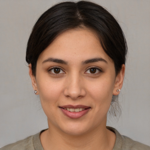 Joyful white young-adult female with medium  brown hair and brown eyes