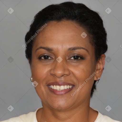 Joyful latino adult female with short  brown hair and brown eyes