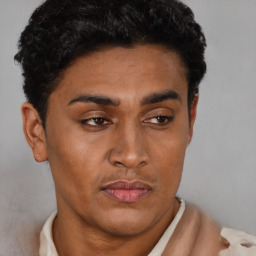 Joyful latino young-adult male with short  brown hair and brown eyes