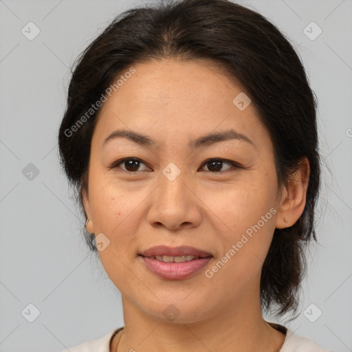 Joyful white adult female with medium  brown hair and brown eyes