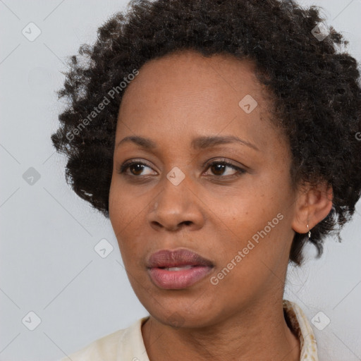 Neutral black young-adult female with short  brown hair and brown eyes