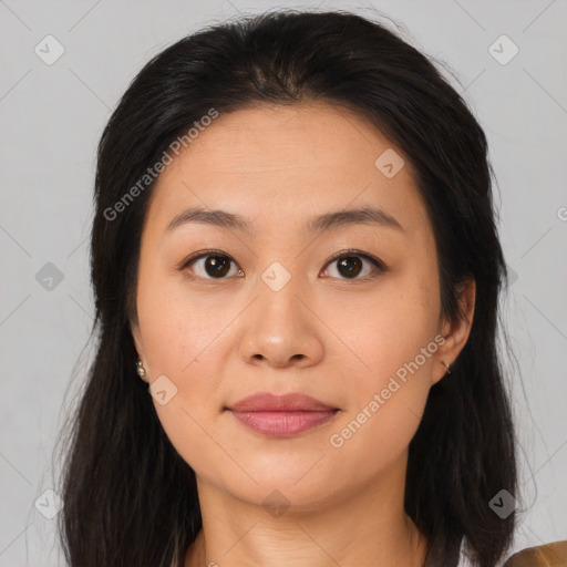 Joyful asian young-adult female with long  brown hair and brown eyes