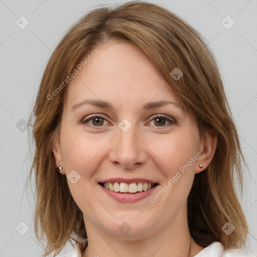 Joyful white adult female with medium  brown hair and grey eyes