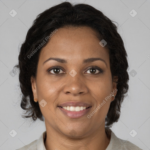 Joyful black adult female with medium  brown hair and brown eyes