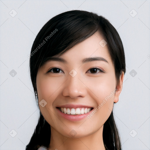 Joyful white young-adult female with long  black hair and brown eyes