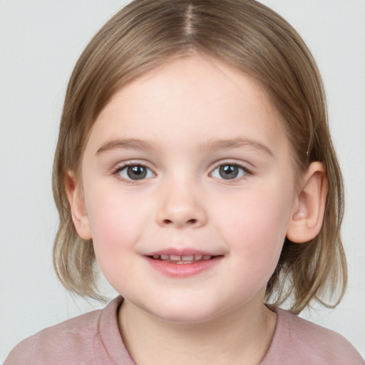 Joyful white child female with medium  brown hair and grey eyes