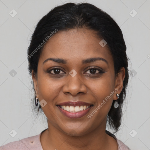 Joyful black young-adult female with medium  brown hair and brown eyes