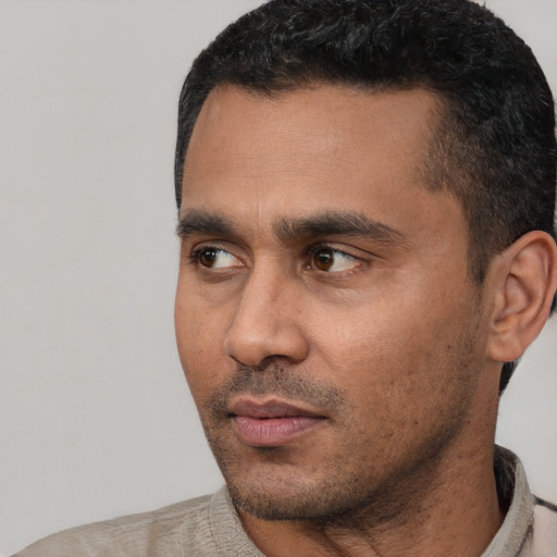 Neutral latino adult male with short  black hair and brown eyes