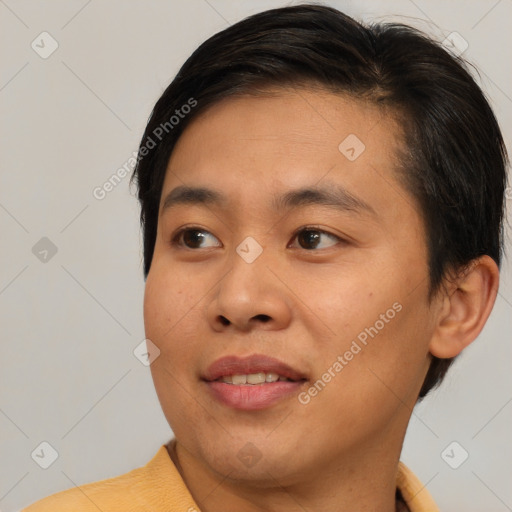 Joyful asian young-adult male with short  brown hair and brown eyes