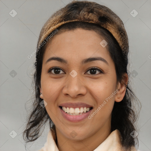 Joyful latino young-adult female with medium  brown hair and brown eyes