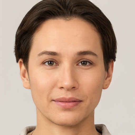 Joyful white young-adult female with short  brown hair and brown eyes