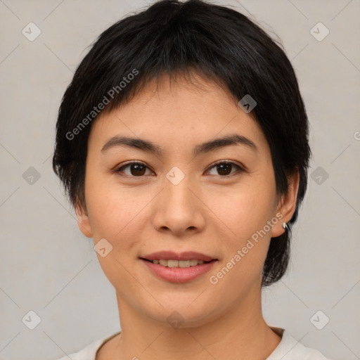 Joyful asian young-adult female with medium  brown hair and brown eyes